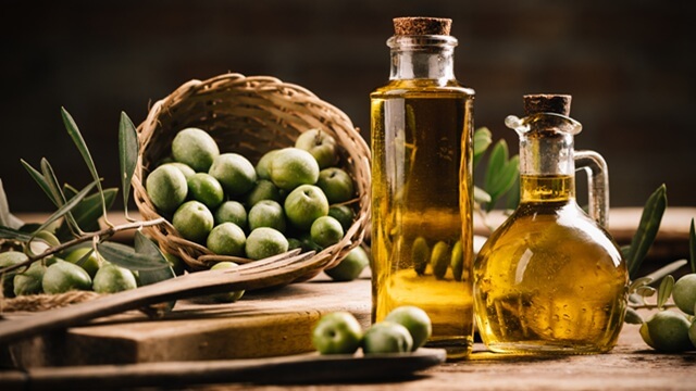 olive-oil-green-olives-rustic-table.jpeg